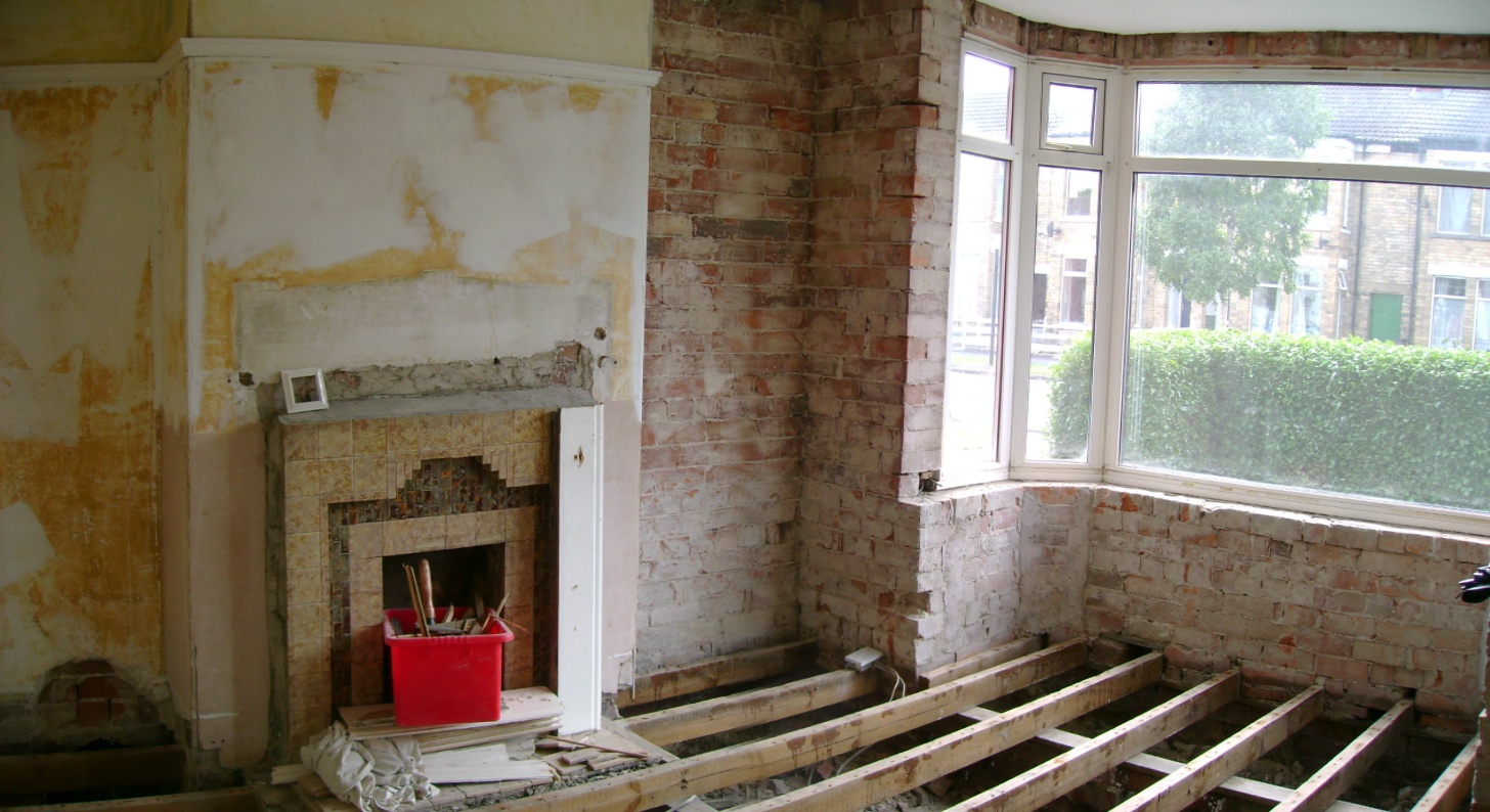 Front room almost destroyed. erm, I mean ready for under floor and wall insulation.