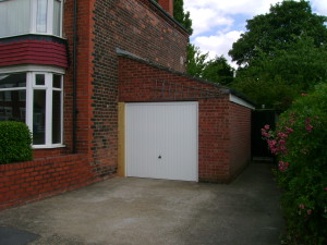 A new, narrower garage door, with clearance on the left for the EWI.