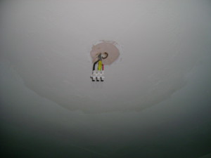 Light fitting wires penetrating ceilings can cause air leakage to the roof space above.